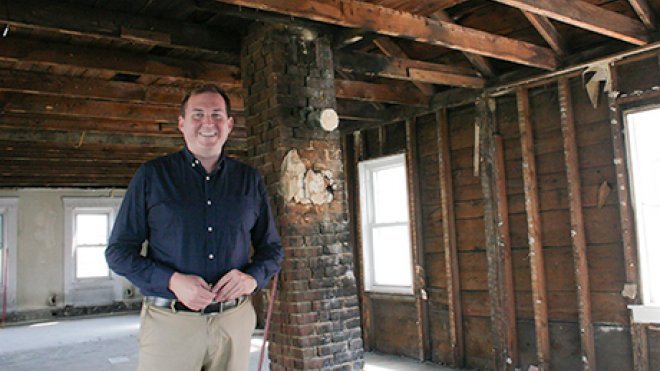 Ben Bergenholtz inside a building under renovation.