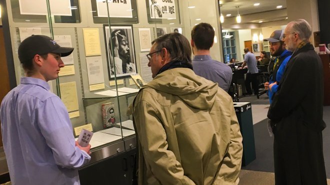 Students provide guided tour of exhibition they curated.