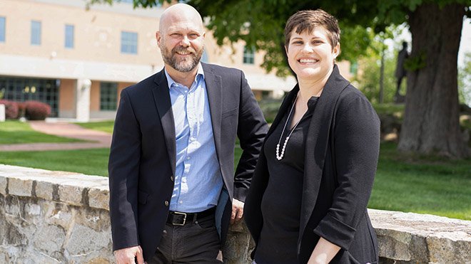 Jason Jacobs and Elaine Stiles outside the RWU library 