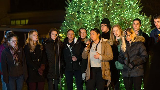 Hawkward members sing during Winter Illumination