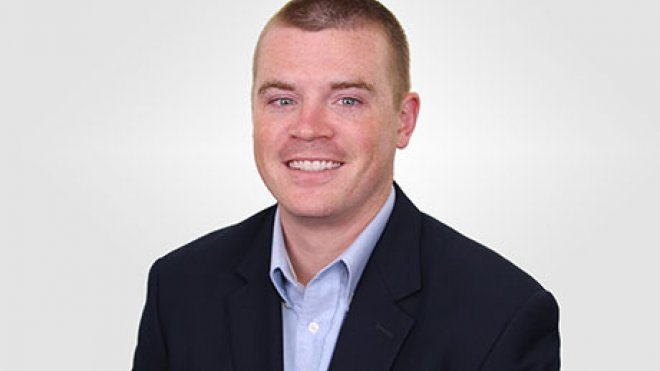 A headshot of Joseph McKenna.