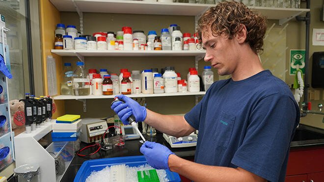 Konnor Collins works in the Aquatic Diagnostic Lab.