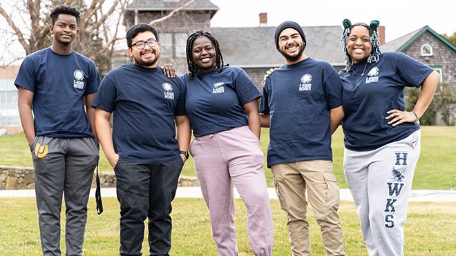 Five of the six MSU executive board members standing in a row outside on campus.