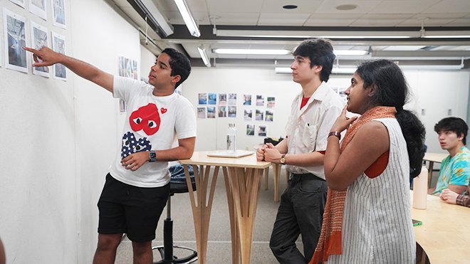 Architecture Adjunct Professor Hanisha Thirth BennaBhaktula and sophomore Architecture major Ignacio Burgos offer guidance and insights to a student.