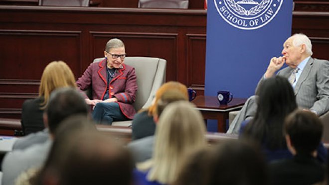 U.S. Supreme Court Justice Ruth Bader Ginsburg talks to 1st U.S. Circuit Court of Appeals Senior Judge Bruce M. Selya