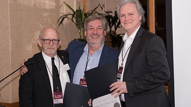 Dean Stephen White and Associate Dean Gregory Laramie accept the award.