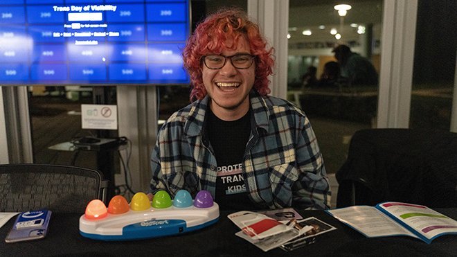 A student sitting in front of a TV screen with Jeopardy questions in GHH