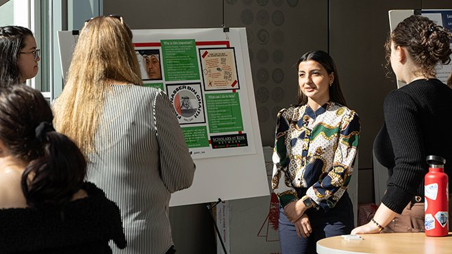 A student presenting her project at SASH