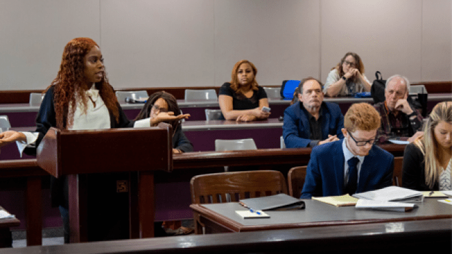 student giving opening statement in trial