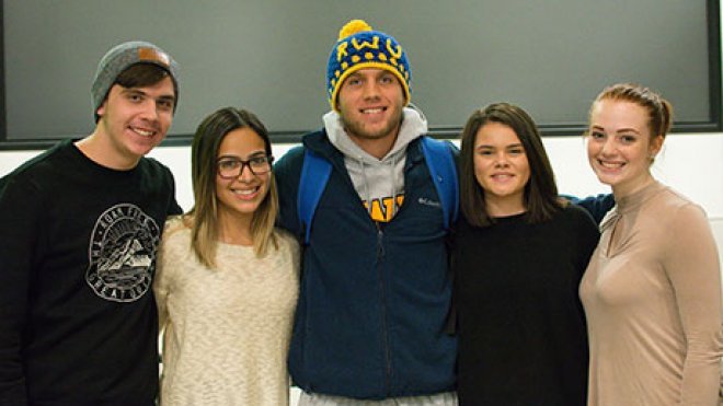 Five students posing for a photo