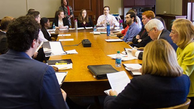 Students present advocacy brief to state legislators.