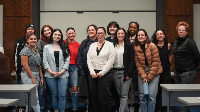 Panelist smile with attending students