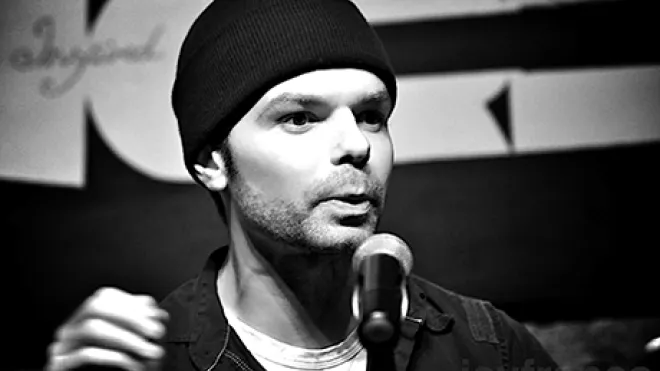 Poet performing on stage.