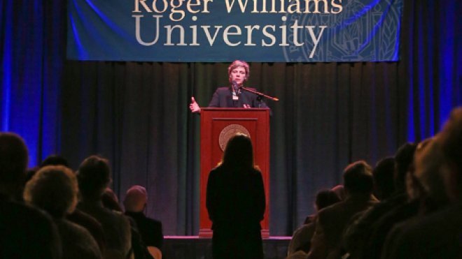 Woman speaks at lectern