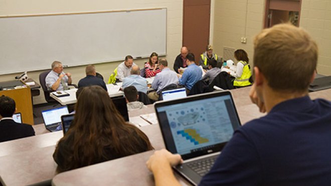 students in construction meeting