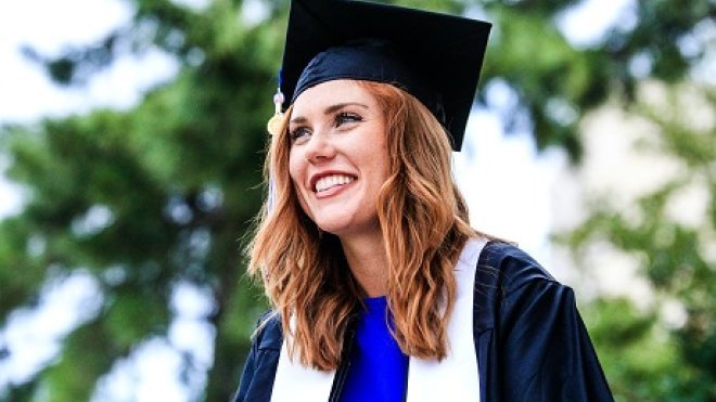 women in cap and gown