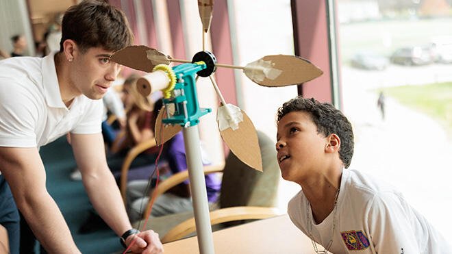 RWU student works with elementary student on a STEM project.