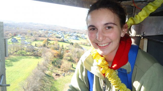 Student climbs to top of wind turbine