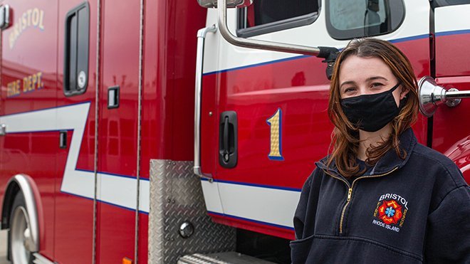 image of RWU Senior Lea Peterson with Bristol Fire Dept. Ambulance