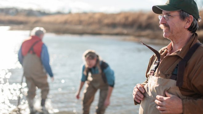 Professor and students work on shoreline