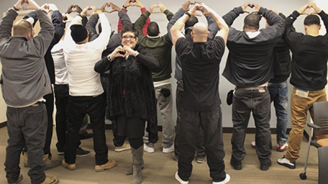 Inmates celebrate their graduation from a job-readiness program.