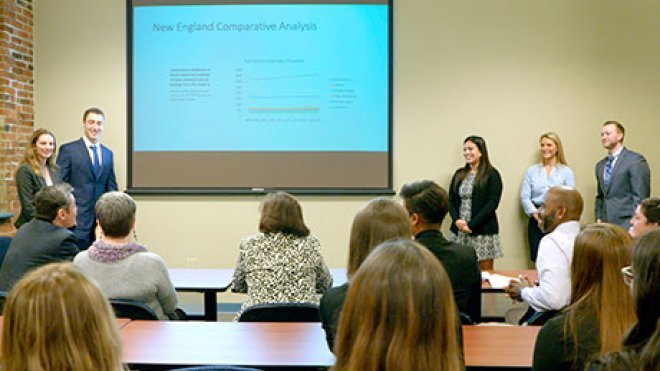 Students present their report to state officials.