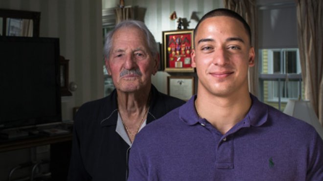 Student poses with a veteran he interviewed