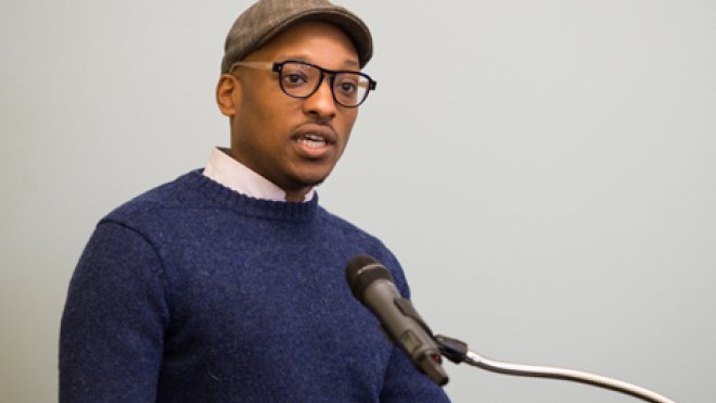 Man speaks at lectern