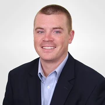 A headshot of Jospeh Mckenna