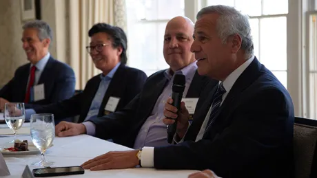 Joseph Paolino, Jr. addresses the audience during a panel discussion titled, “New paradigms within the built environment: Opportunities and challenges for homes, marketplaces and office spaces.”
