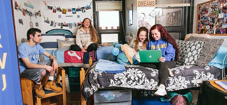 Students sitting in a residential community.