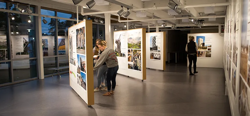 Students take in an exhibit in the Architecture Gallery