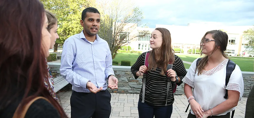 Students talking outdoors in a group