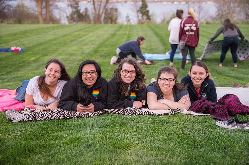 Students laying on the quad