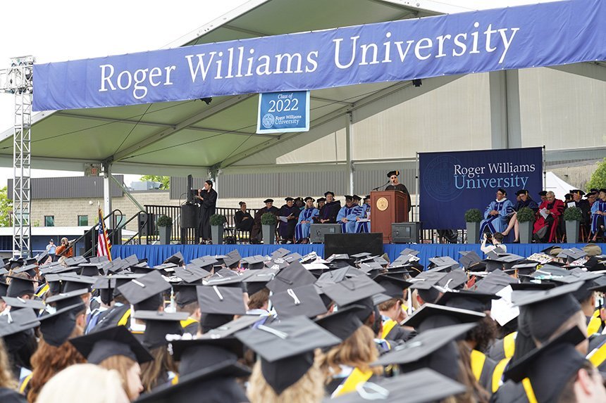 a sea of mortarboards in front of the stage