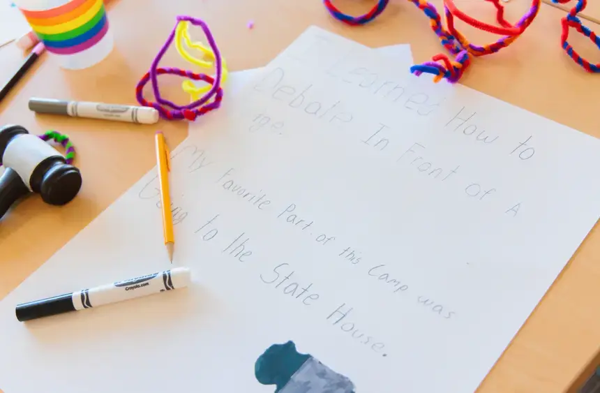 A camper wrote what they learned during the week and notes their favorite part of camp was visiting the State House.