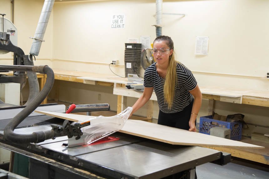 Gabby P. working with wooden base