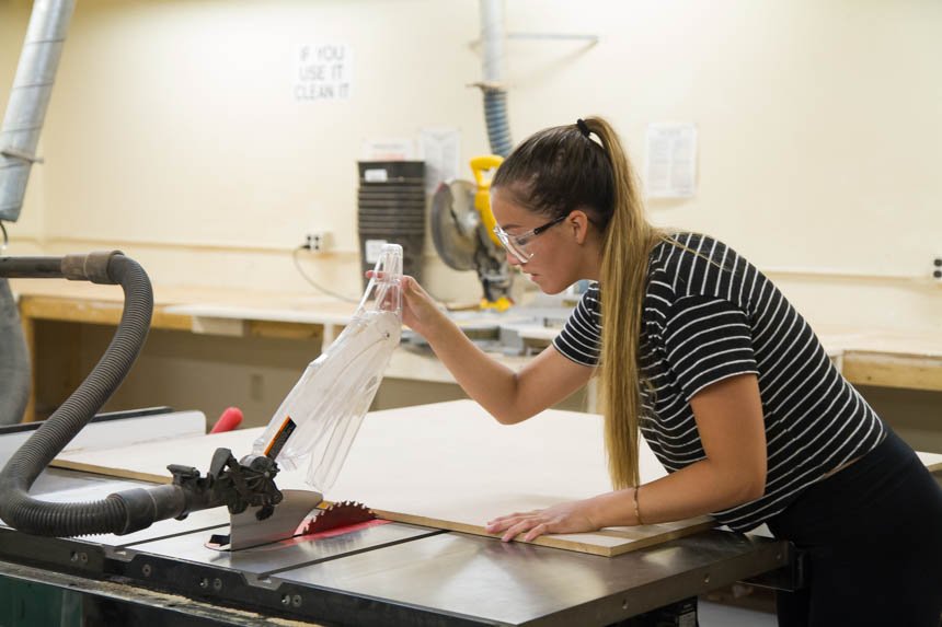 Gabby P. working with a saw