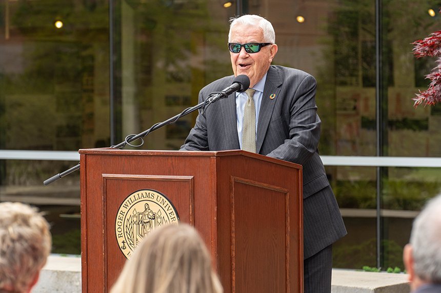 Bill Cummings speaking at a podium