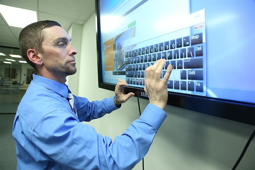 Student using keyborard on TV