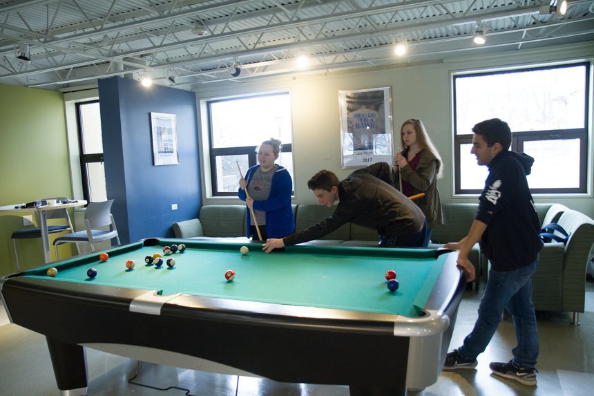 Students playing billards