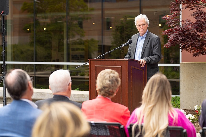 Dean Steve White speaking at a podium