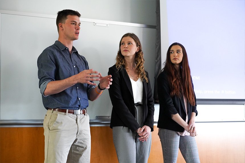 Three Honors students answering questions at SASH 