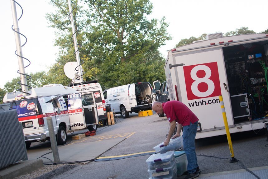 News producer prepares equipment.