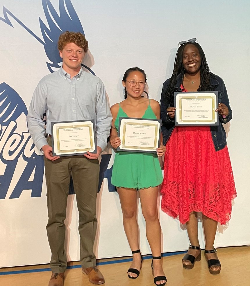 Henderson Outstanding Tutors for 2023 pose inside holding certificates