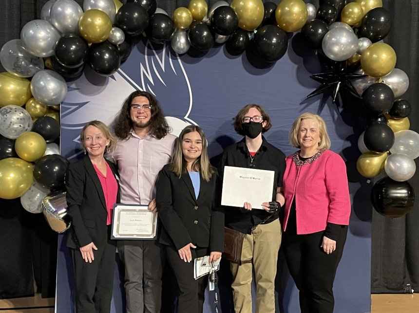 Henderson Outstanding Tutors for 2024 pose inside holding certificates