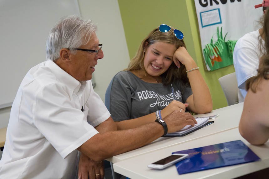 Student smiling with professor