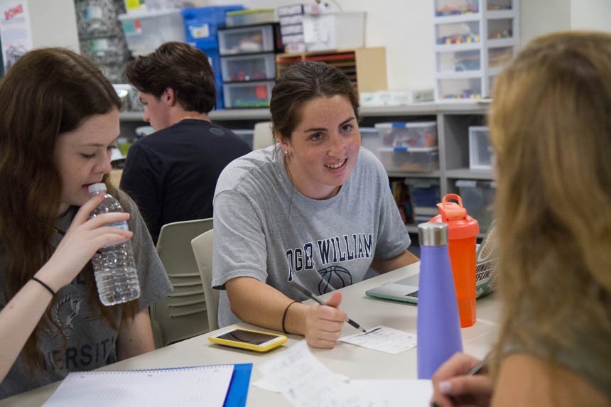 Student speaking with another student