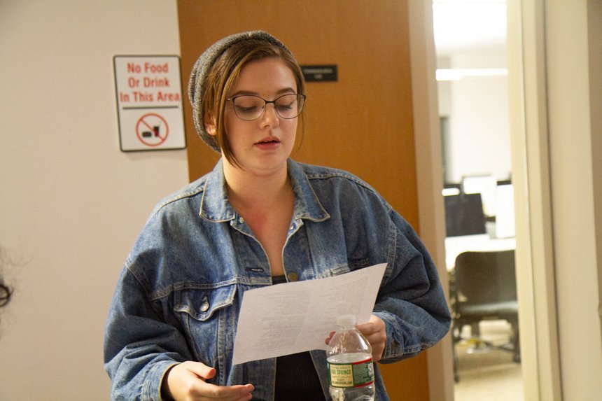 Student reads paper.