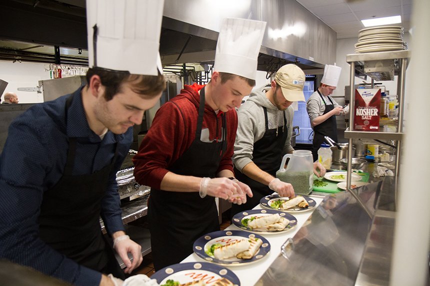 A group of students cooking.